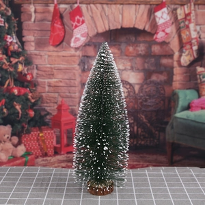 Mini green flocked bottle brush Christmas tree with a round wooden base for tabletop decor