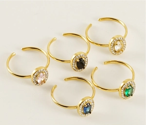 Detail of adjustable double-layer rings with colorful oval stones and zircon halo