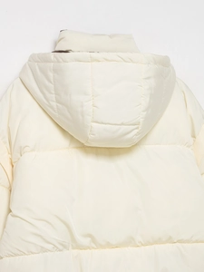 Close-up of cream white hooded puffer jacket with back horizontal quilting and smooth windproof fabric