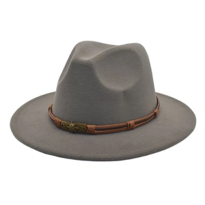 Detail of dark grey wool fedora featuring a braided leather band and skull buckle accent