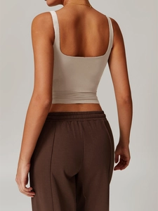 Slim fit beige square neck yoga tank top and brown joggers seen from the back view