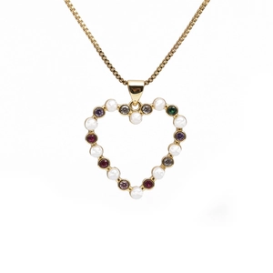 Gold necklace with heart pendant featuring pearls and colorful gemstones on white background