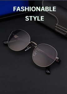 Close-up of round metal frame sunglasses with technical specs H 12 56 18-140 on the temple