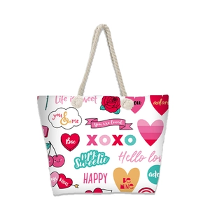 Macro shot of canvas tote bag with heart and cherry print plus thick rope handles