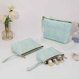 Three-piece iridescent mermaid scale makeup bag set with zipper closure and carry handles