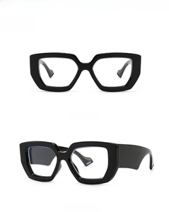 Close-up of black oversized eyeglass frames showing front and side profile details