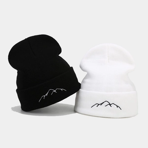 Minimalist knit beanie with mountain embroidery in classic black and white style