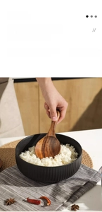 Teak wood rice paddle with ergonomic handle and smooth finish for non-stick cookware