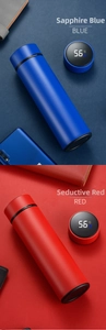 Close-up of smart LED temperature display on sapphire blue and red thermal flasks