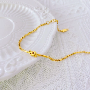 Minimalist 18k gold-plated knot chain bracelet with adjustable extender for women