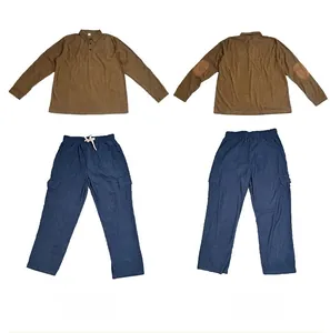 Detail view of brown corduroy shirt with elbow patches and navy drawstring cargo pants