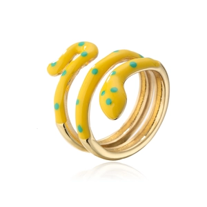Detail of creative snake-shaped ring with yellow enamel and blue dots on 18K gold plating