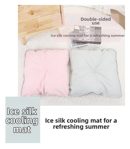 Close-up of dual-sided cooling ice silk mats for pets in soft pink and light grey
