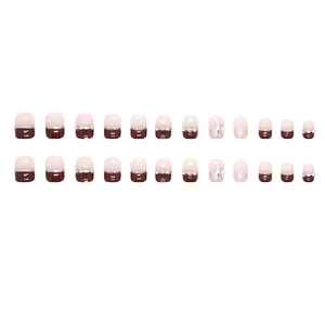 Elegant burgundy French tip press-on nails with luxury chain accents and glitter