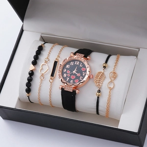 Women's watch and bracelet gift set in black box featuring heart dial and gold jewelry