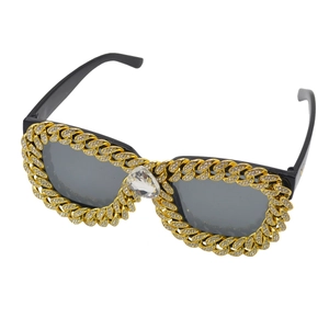 Cat eye sunglasses with golden Cuban link frame and teardrop crystal accents