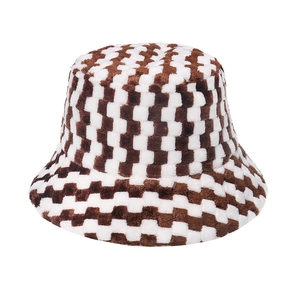 Detail of plush brown and white checkerboard bucket hat with soft fuzzy texture