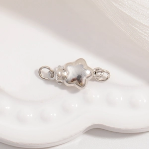 Macro shot of polished S925 sterling silver star connector for DIY jewelry making