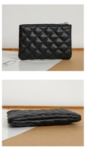 Detail view of black quilted PU leather coin purse with silver metal zipper closure