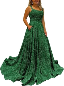 Detail shot of shimmering emerald green sequins and practical side pockets on the gown