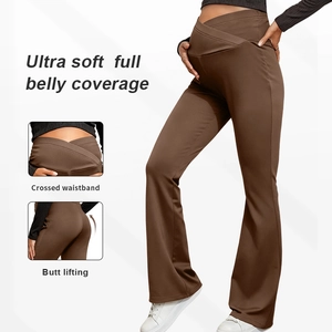 Detail view of maternity flare yoga pants with crossed waistband and belly support