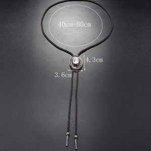 Detail view of brown braided leather bolo tie with silver vintage pendant and dimensions