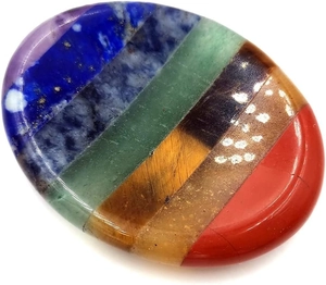 Detailed macro view of an oval seven-chakra worry stone with polished natural ore layers