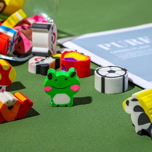 Assorted cute animal cartoon erasers including frog and panda shapes for kids school stationery