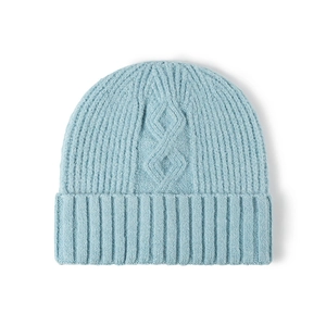 Soft light blue winter knit beanie with thick cable patterns and protective ear flaps