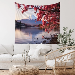 Detail of Mt. Fuji tapestry with cherry blossoms hanging over a white sofa in a cozy room