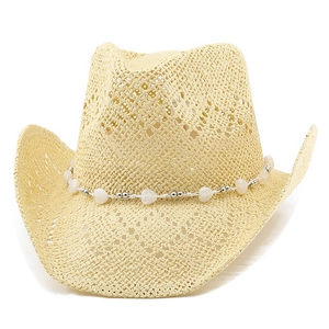 Macro view of woven straw cowboy hat featuring heart bead trim and breathable texture
