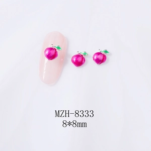 Macro detail of 8x8mm 3D rose pink peach alloy nail art charms with green leaves