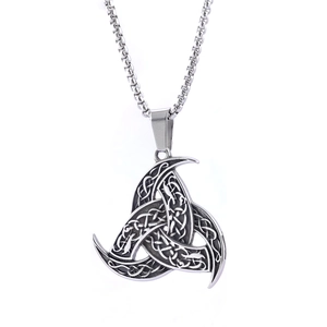 Detailed macro view of the vintage stainless steel Viking Odin's Horns knot pendant texture