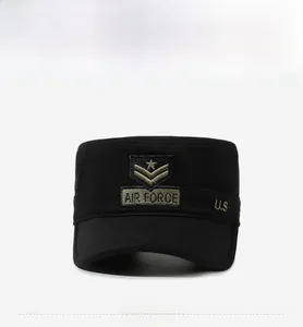 Close-up of black military cadet hat featuring gold Air Force embroidery and star patch