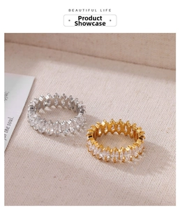 Detail of marquise-cut cubic zirconia full eternity rings in silver and gold finishes