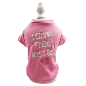 Detail of pink pet t-shirt featuring I GIVE FREE KISSES slogan and heart patterns