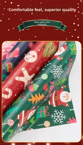 Detail view of assorted Christmas wrapping paper with gingerbread men and Santa patterns