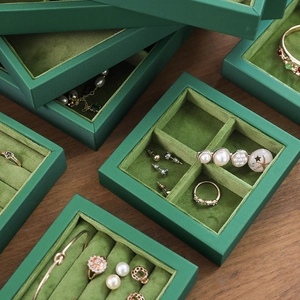 Stackable green faux leather jewelry organizers with soft velvet lining for rings and necklaces