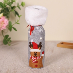 Detailed view of Christmas wine bottle cover with reindeer pattern and white faux fur trim