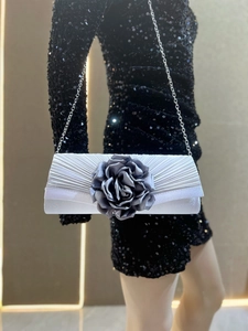 Silver pleated evening clutch bag with dark grey rose flower and metal chain strap for women.