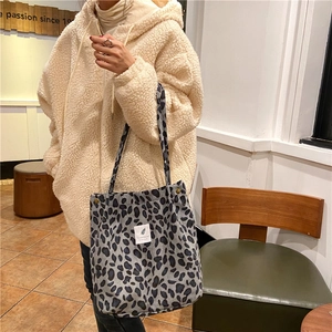 Leopard print corduroy tote bag detail showing large capacity and soft fuzzy texture