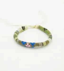 Detail of bohemian hand-woven surf bracelet with adjustable knot and ethnic pattern