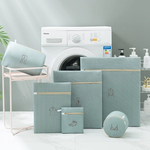 Detailed set of 6 Morandi green laundry bags with delicate embroidery for garment care
