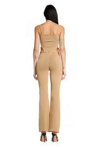Detail view of khaki knit two-piece set featuring backless top and flared trousers
