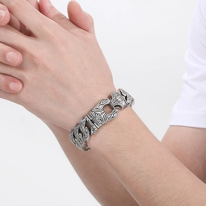 Men's vintage silver stainless steel chain bracelet with intricate rock totem carvings
