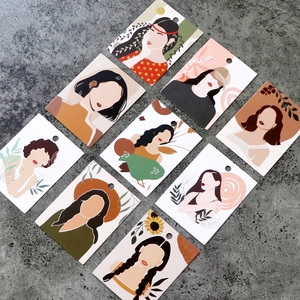 Detail view of nine jewelry display cards with colorful modern art female portraits