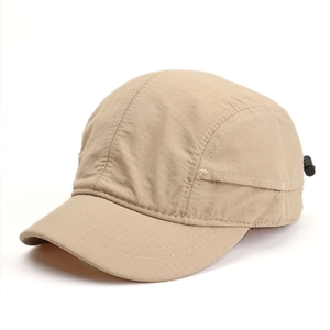 Detailed close-up of khaki ripstop nylon texture and plastic buckle on baseball cap
