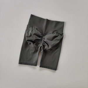 Close-up of charcoal grey high-waisted seamless scrunch butt lifting biker shorts