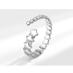 Close-up of vintage style silver star ring featuring unique open band and 3D star details