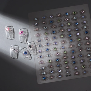 Detailed view of 3D devil eye nail art stickers with realistic embossed textures
